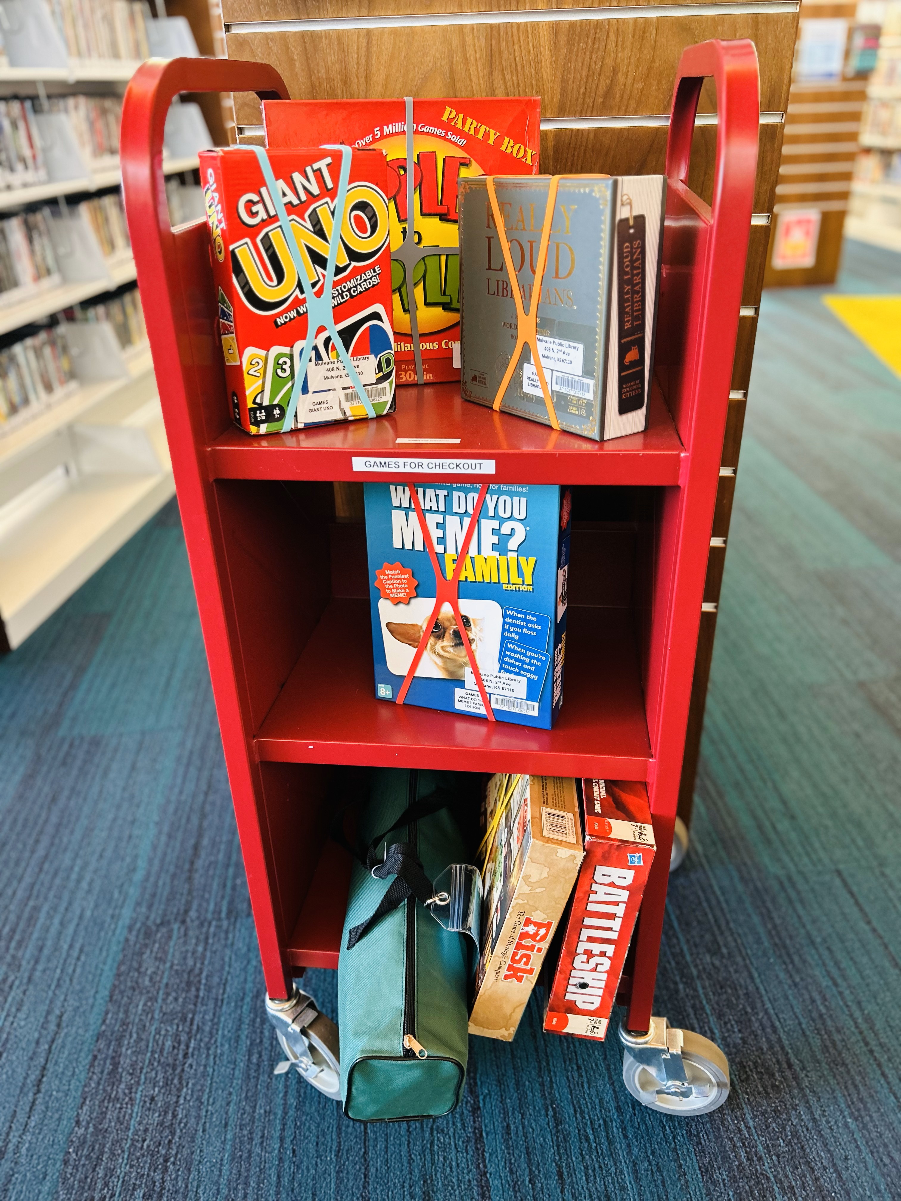 Red cart with various board games
