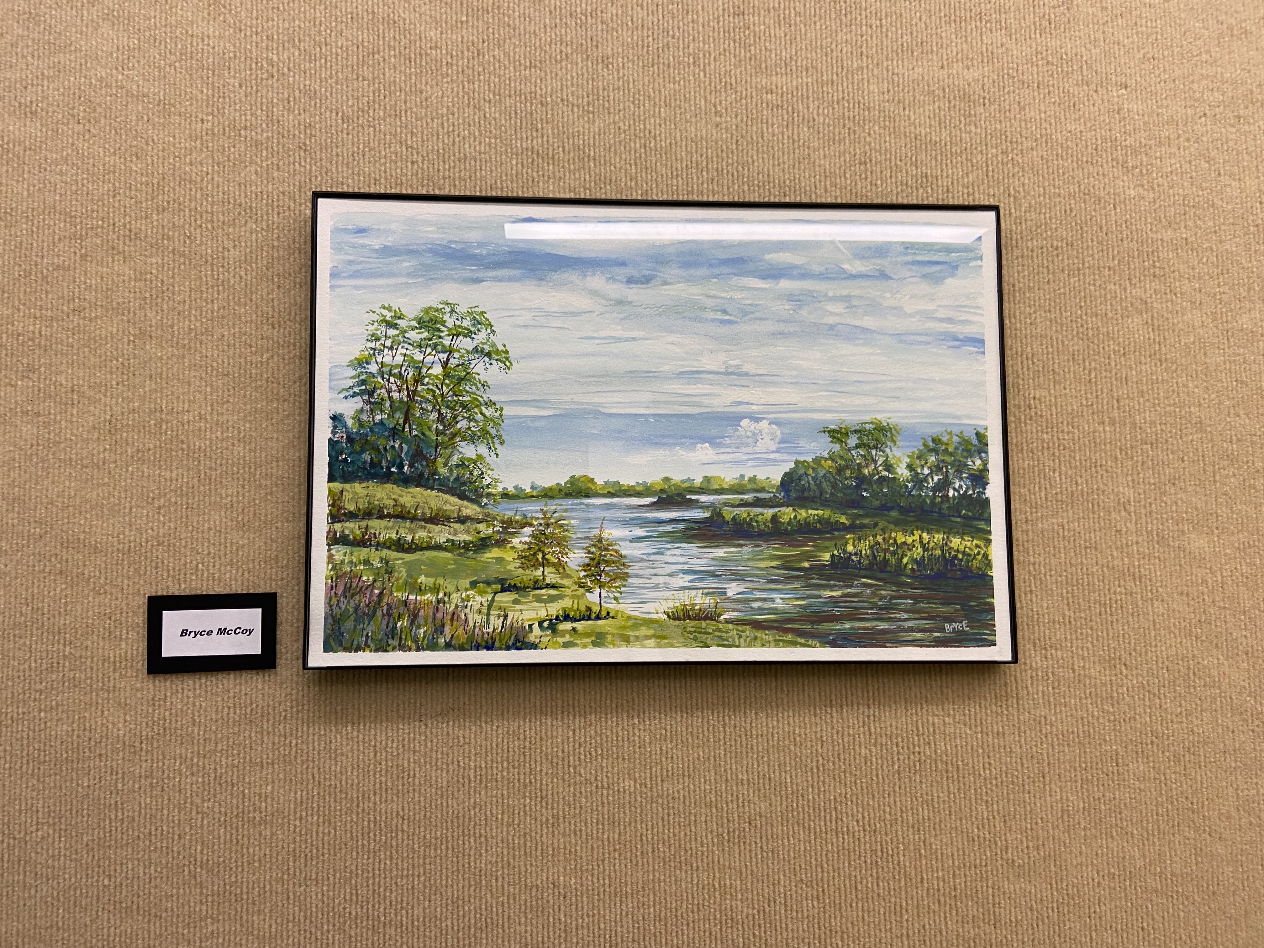 beige background with framed landscape painting