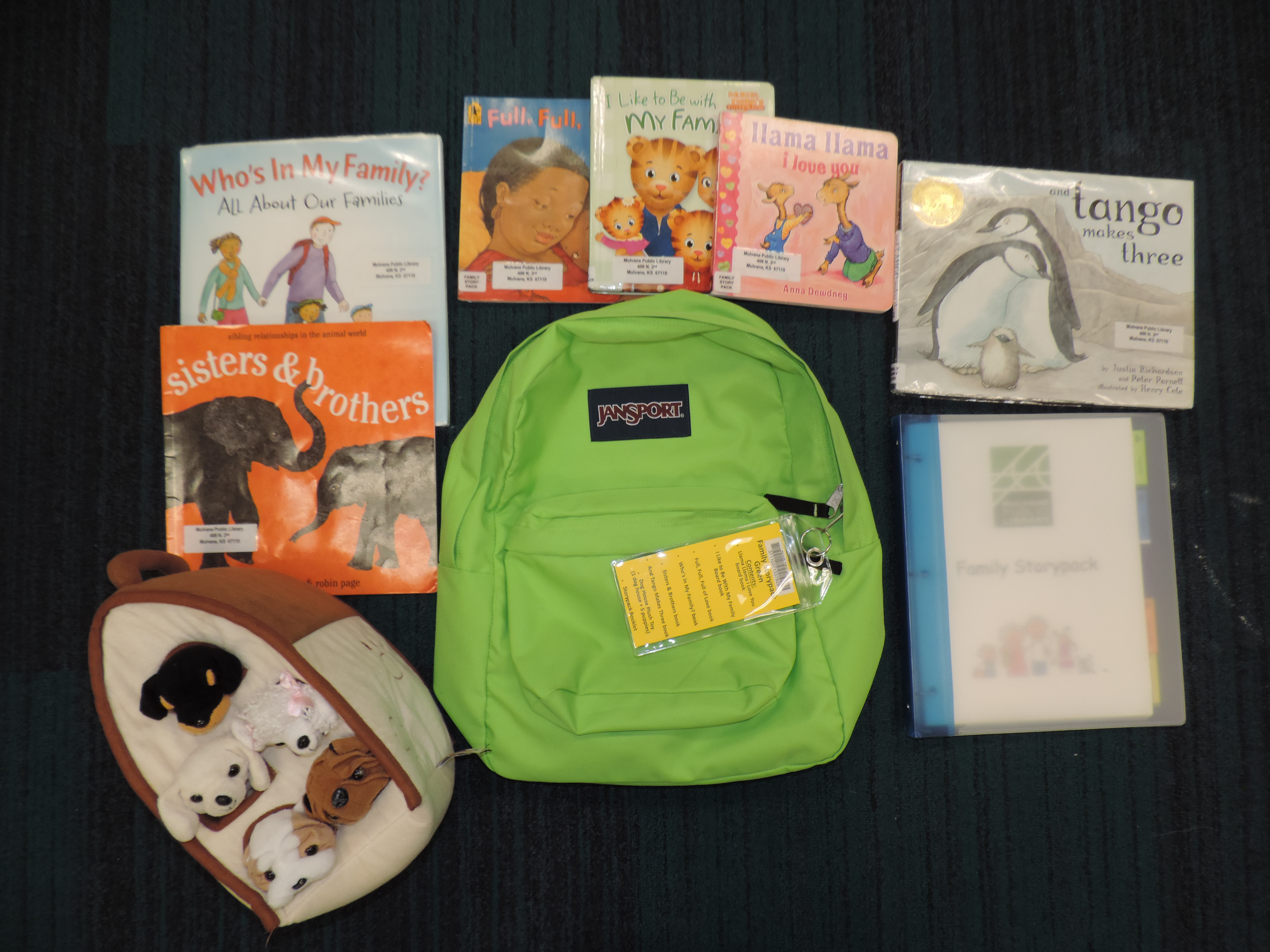 Green backpack with books and activities