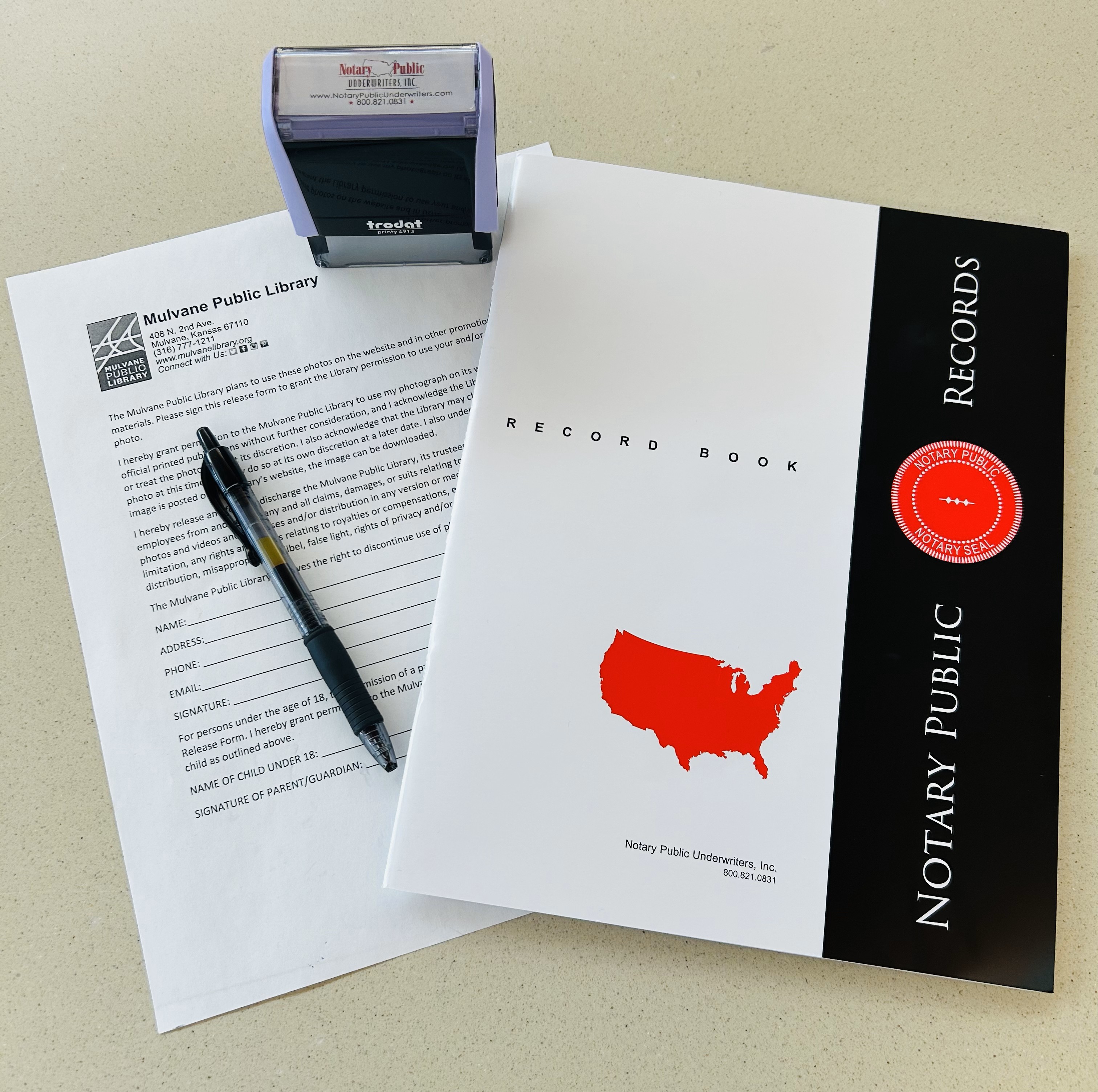 beige background with Notary Public Records Book and Stamp