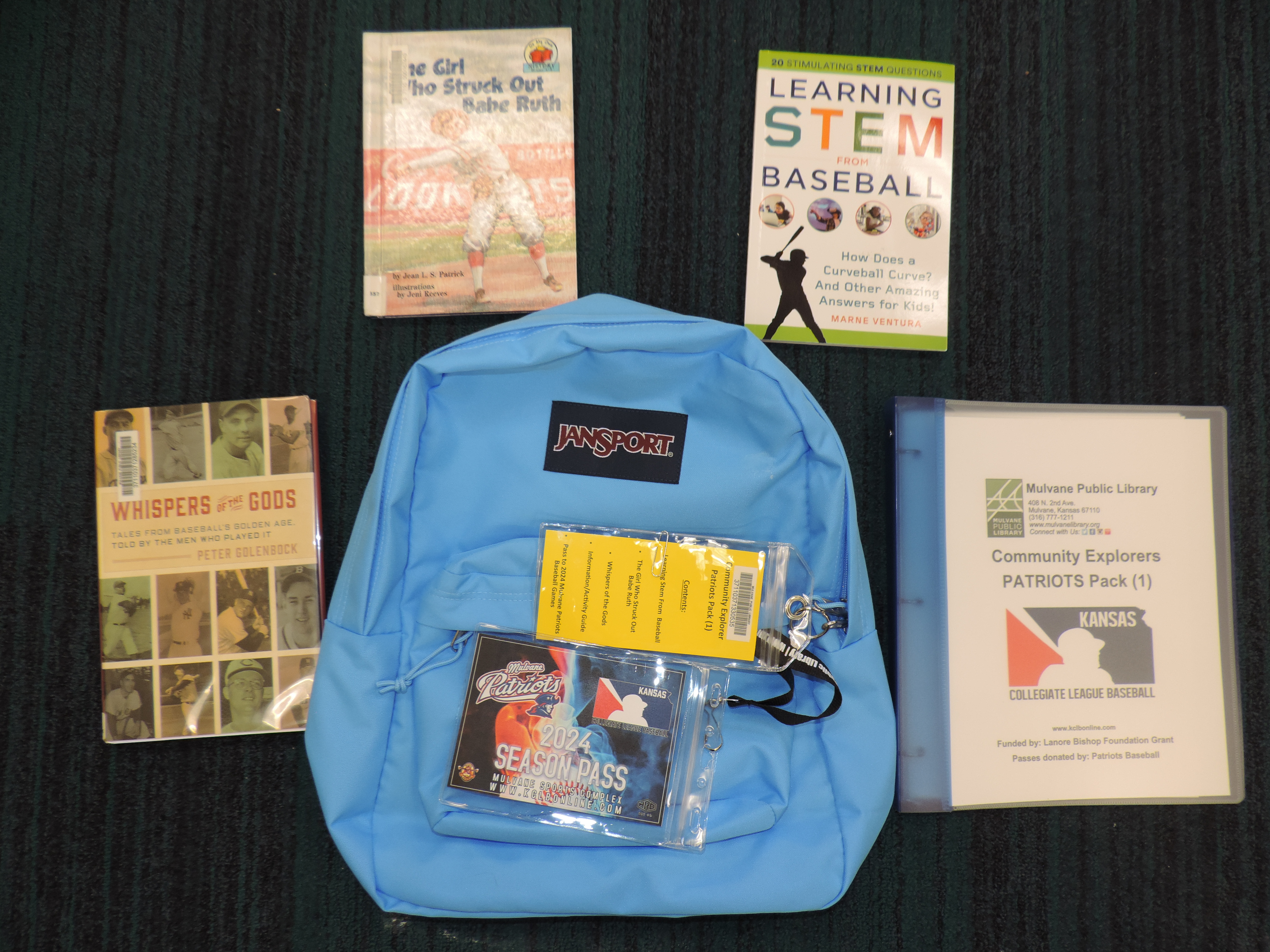 Blue backpack with books and pass to patriots games, activity guide