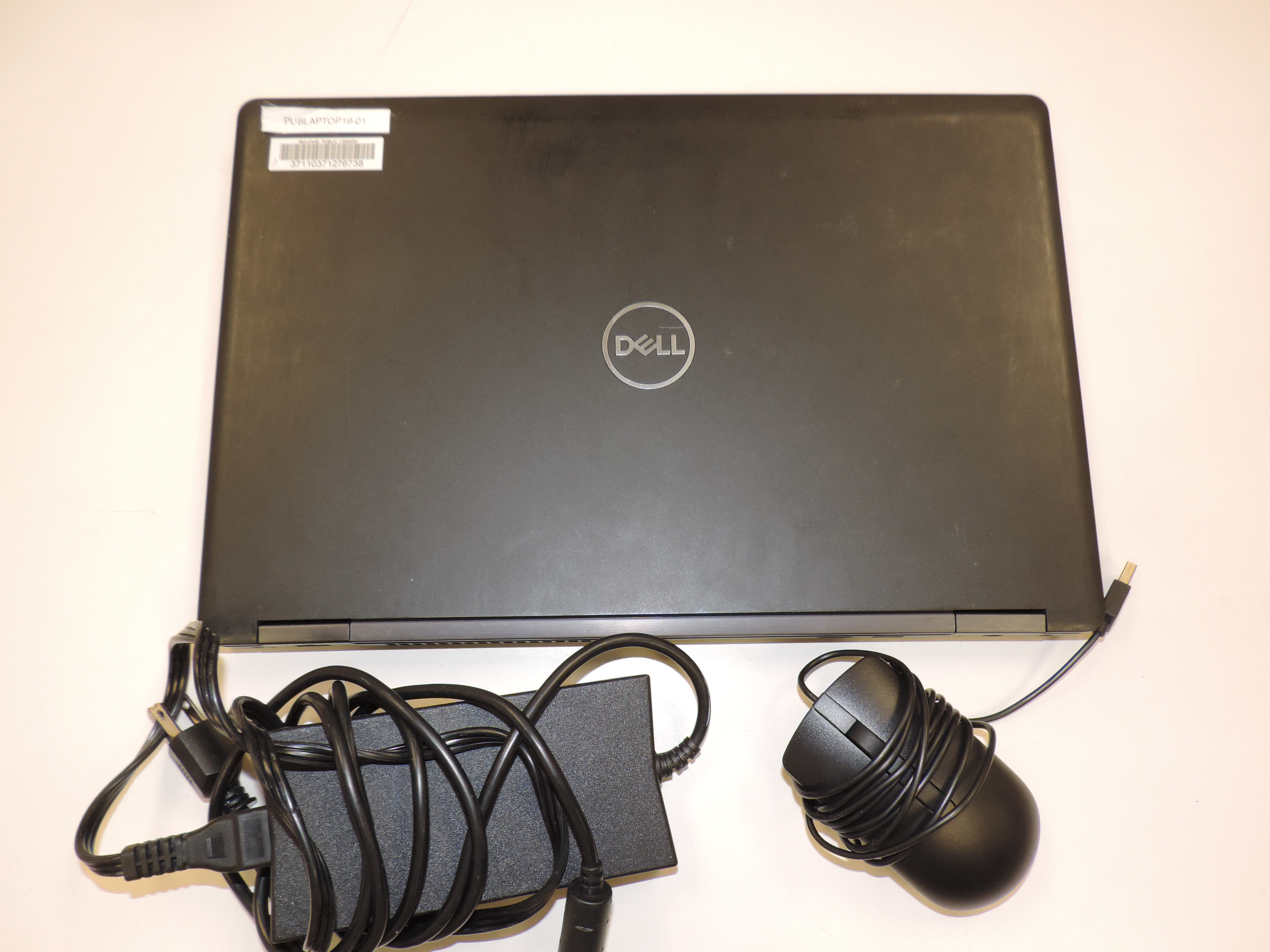 Laptop with mouse and charger cord