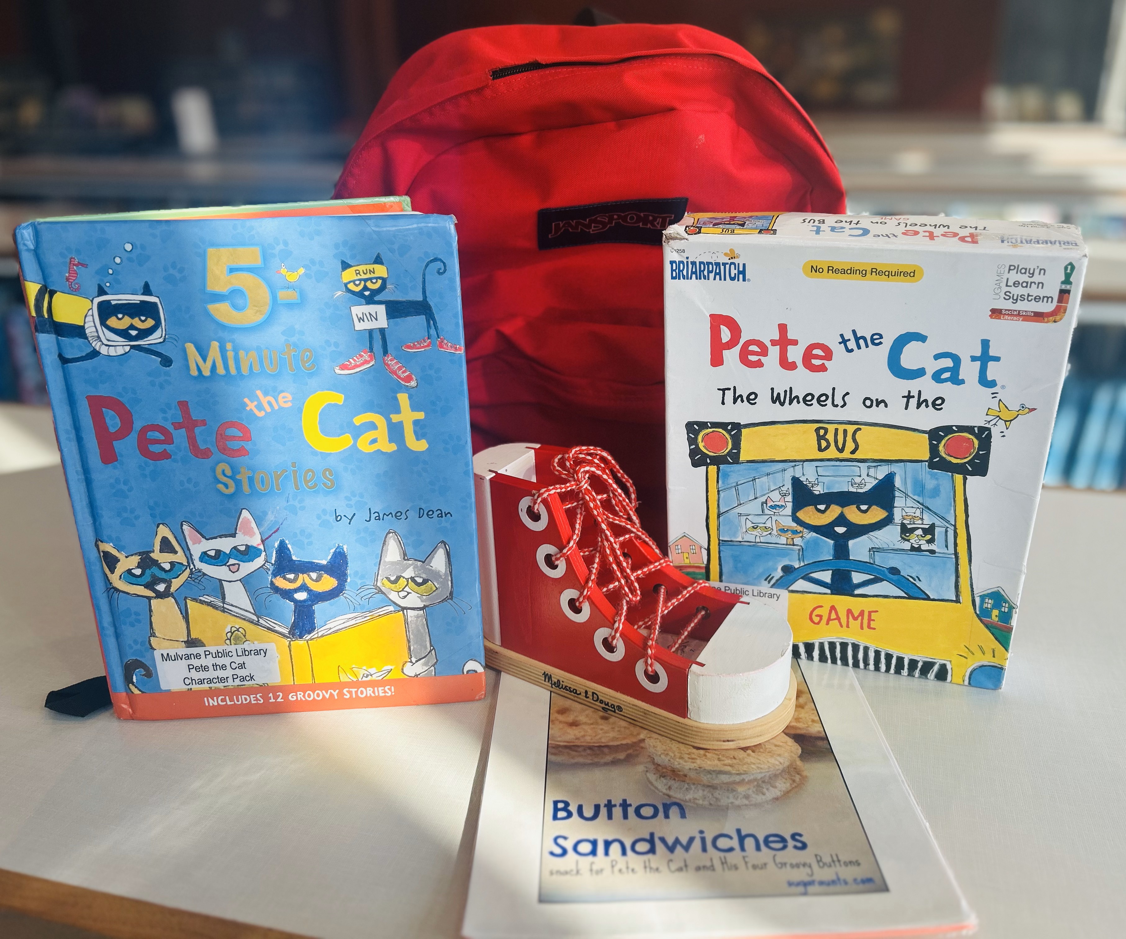 Red backpack with books and activities