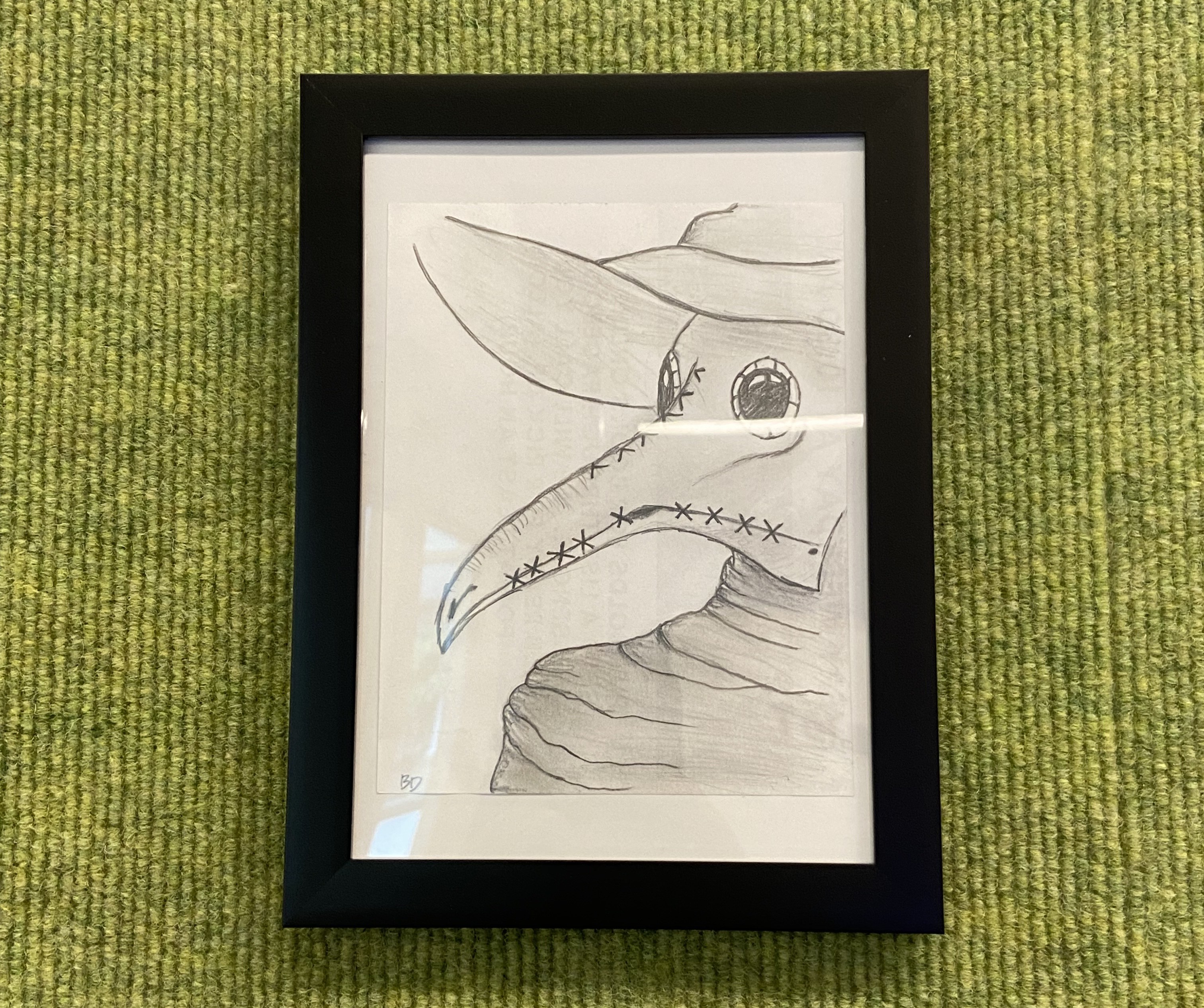 framed drawing of plague doctor