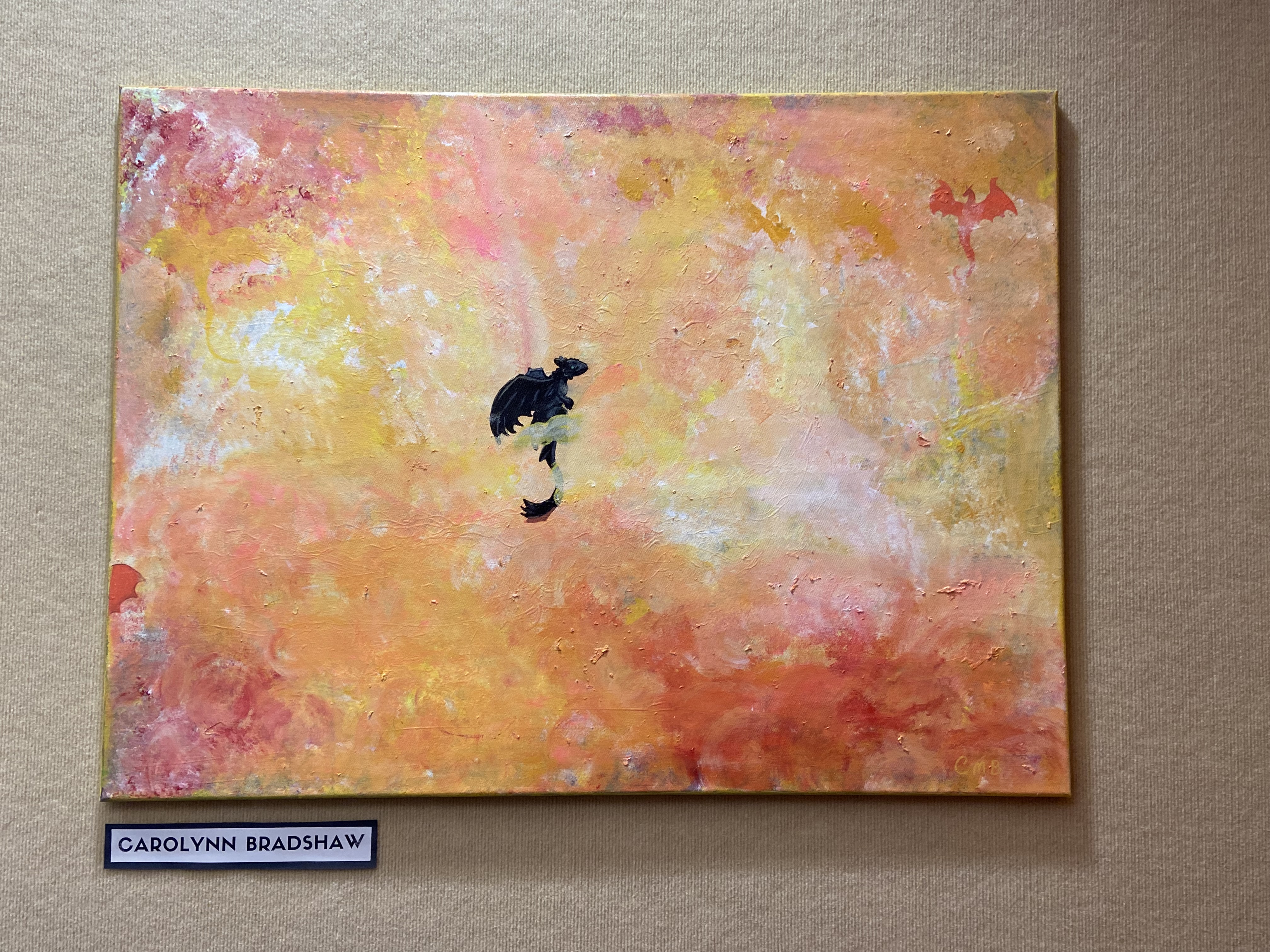 large canvas dragon art on beige textured background