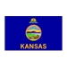 blue background with the word Kansas and badge with landscape