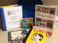 Blue backpack with books and museum pass