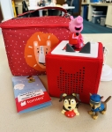 Red toniebox with red lion carrying case, peppa pig figurine, playtime puppy figurine, paw patrol puppy figuring, instruction sheet