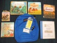 Blue backpack with books and museum pass