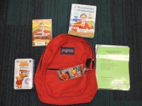 Red backpack with books and activities