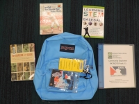 Blue backpack with books and pass to patriots games, activity guide