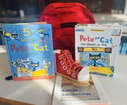 Red backpack with books and activities