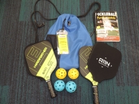 Blue backpack with 2 pickleball paddles, 4 pickleball balls and activity guide