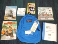Blue backpack with books and museum pass