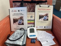 Blood pressure monitor with information and carrying case