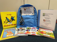 Blue backpack with books and museum pass